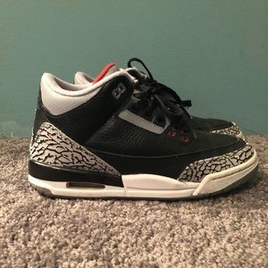 Black, grey, and red Jordan’s